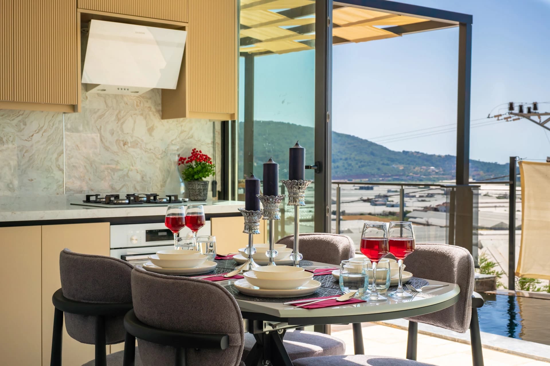 Open-plan dining and kitchen area with sweeping mountain and valley views.