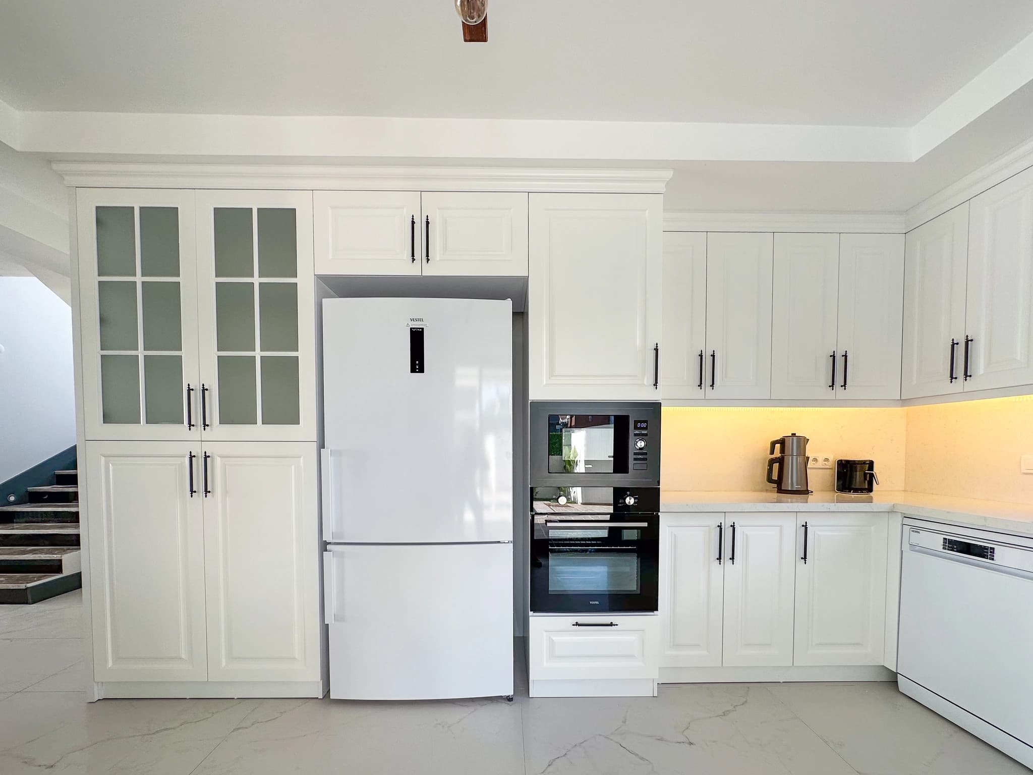 Spacious master bedroom with king bed, split AC unit, and access to a terrace.