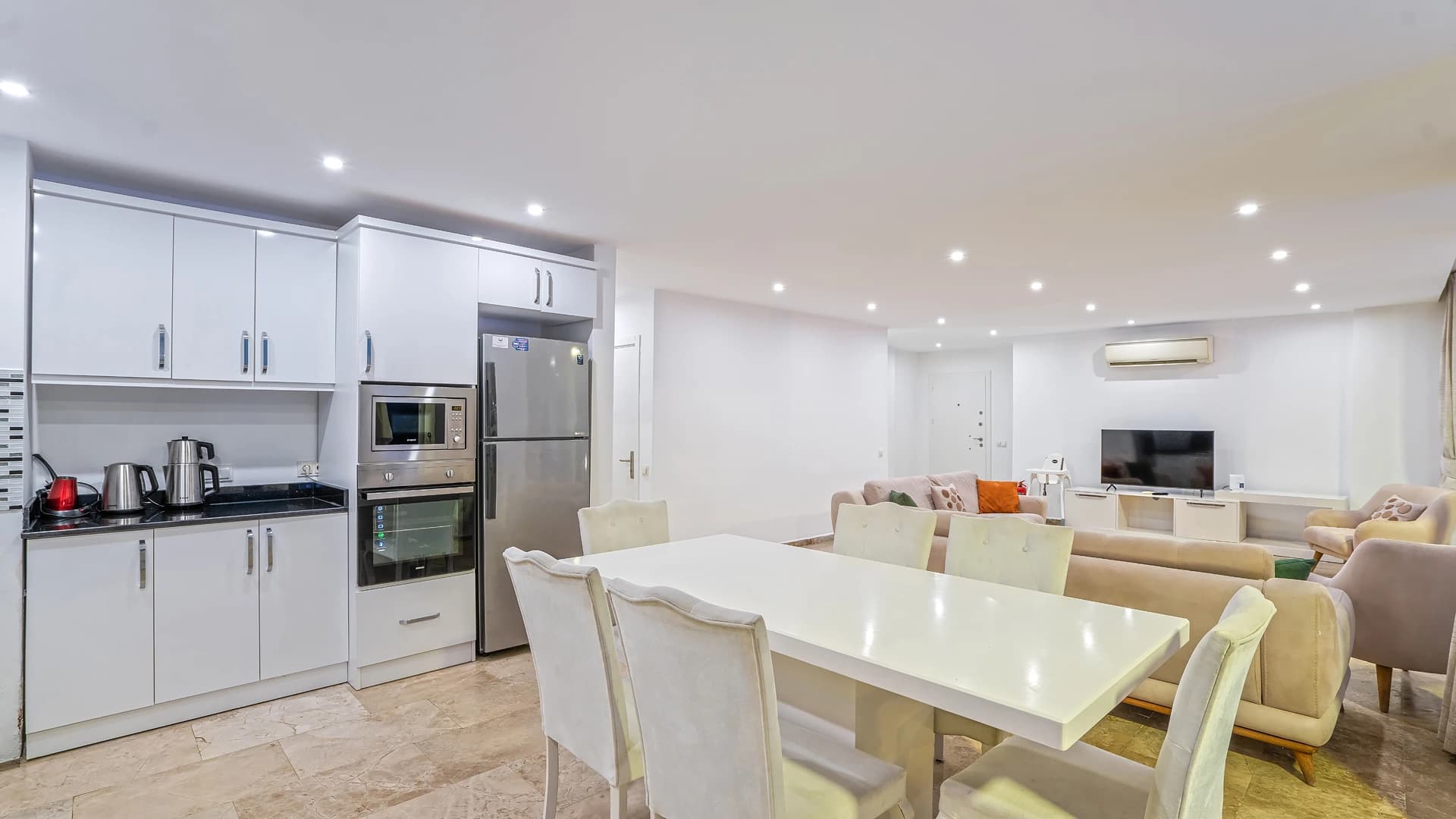 Open-plan dining and kitchen area with modern finishes.