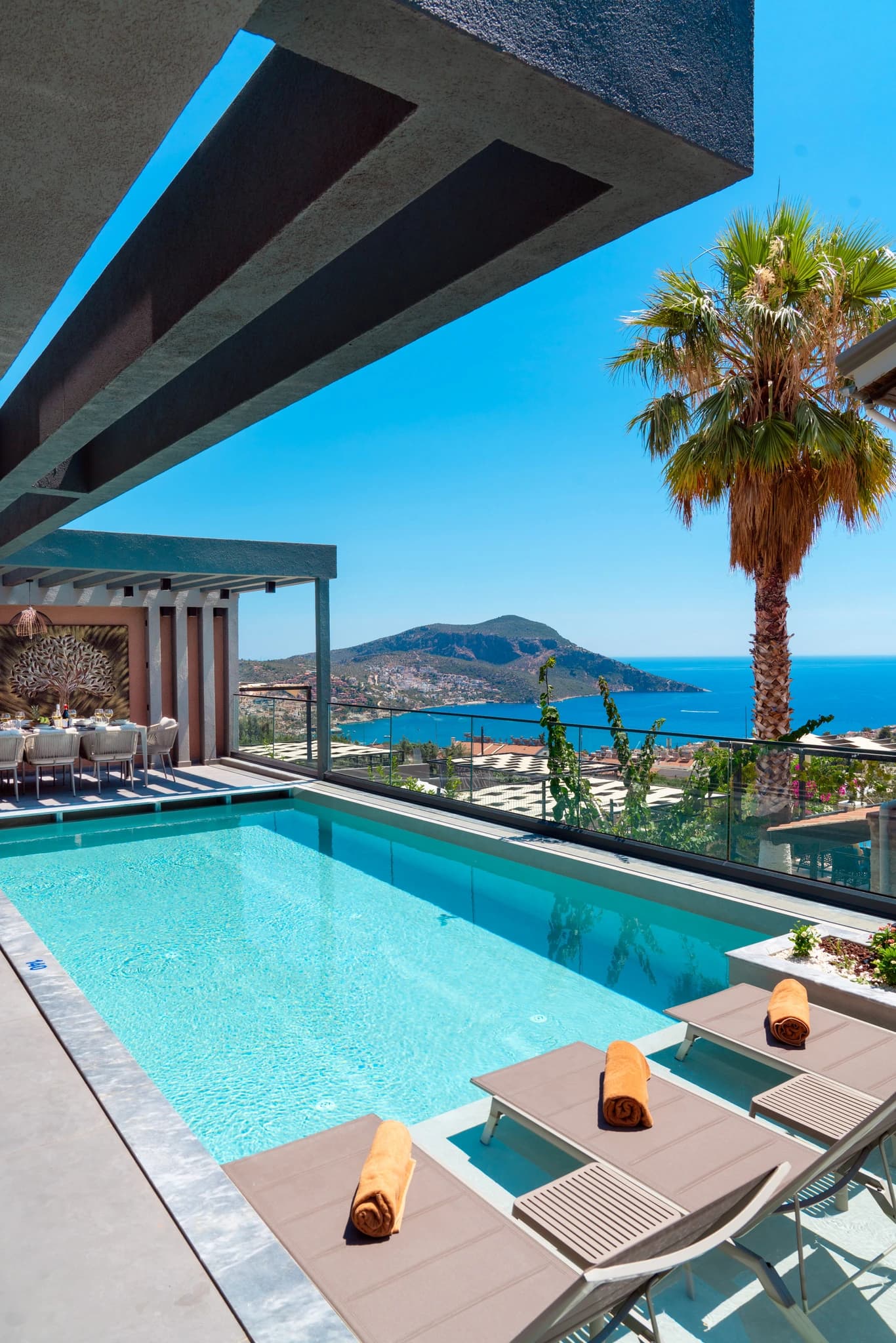 Stunning private pool with panoramic sea and mountain views.