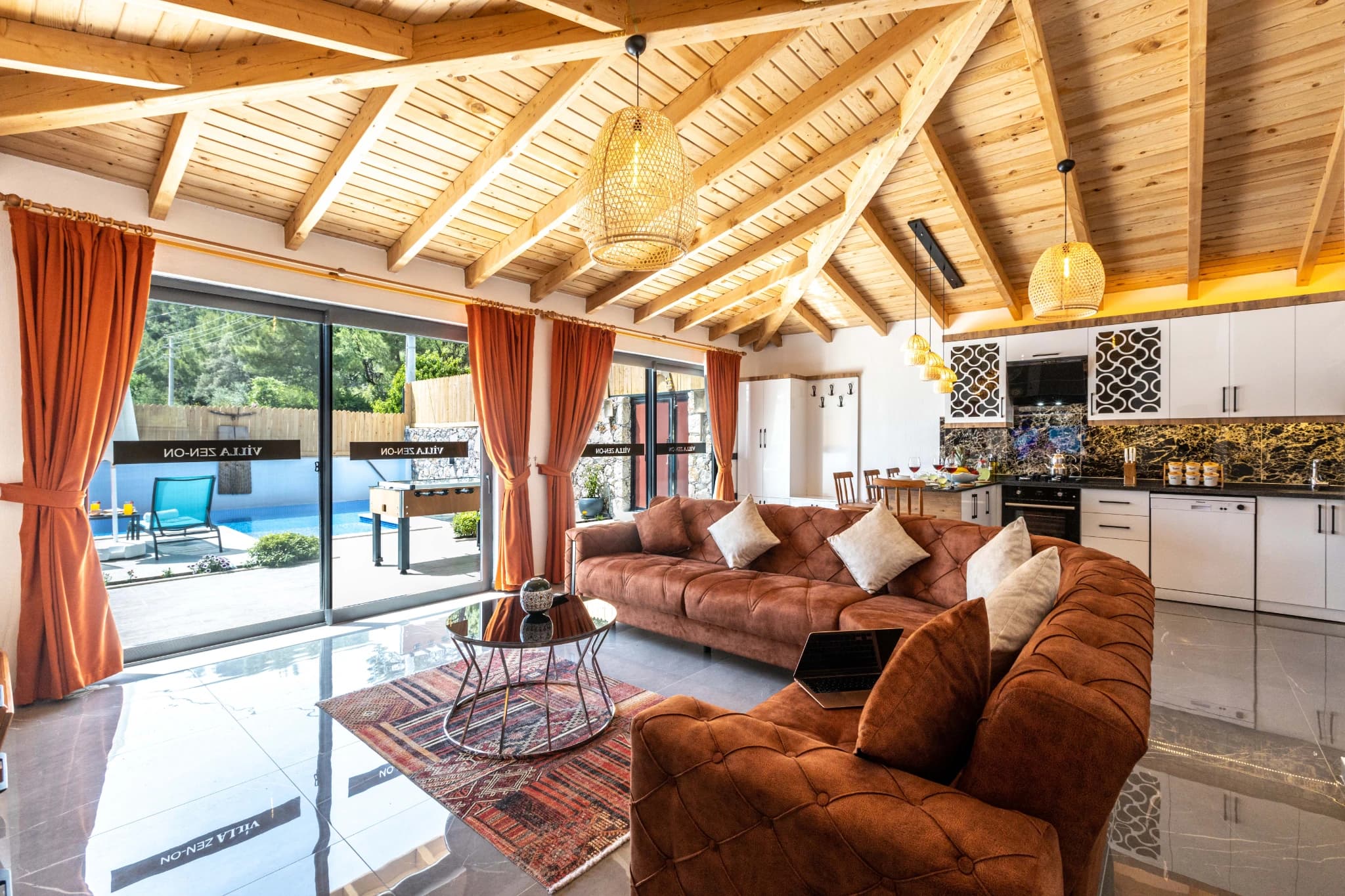 Living room with direct pool and garden access through sliding glass doors.